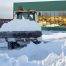 Commercial snow plow clearing snow