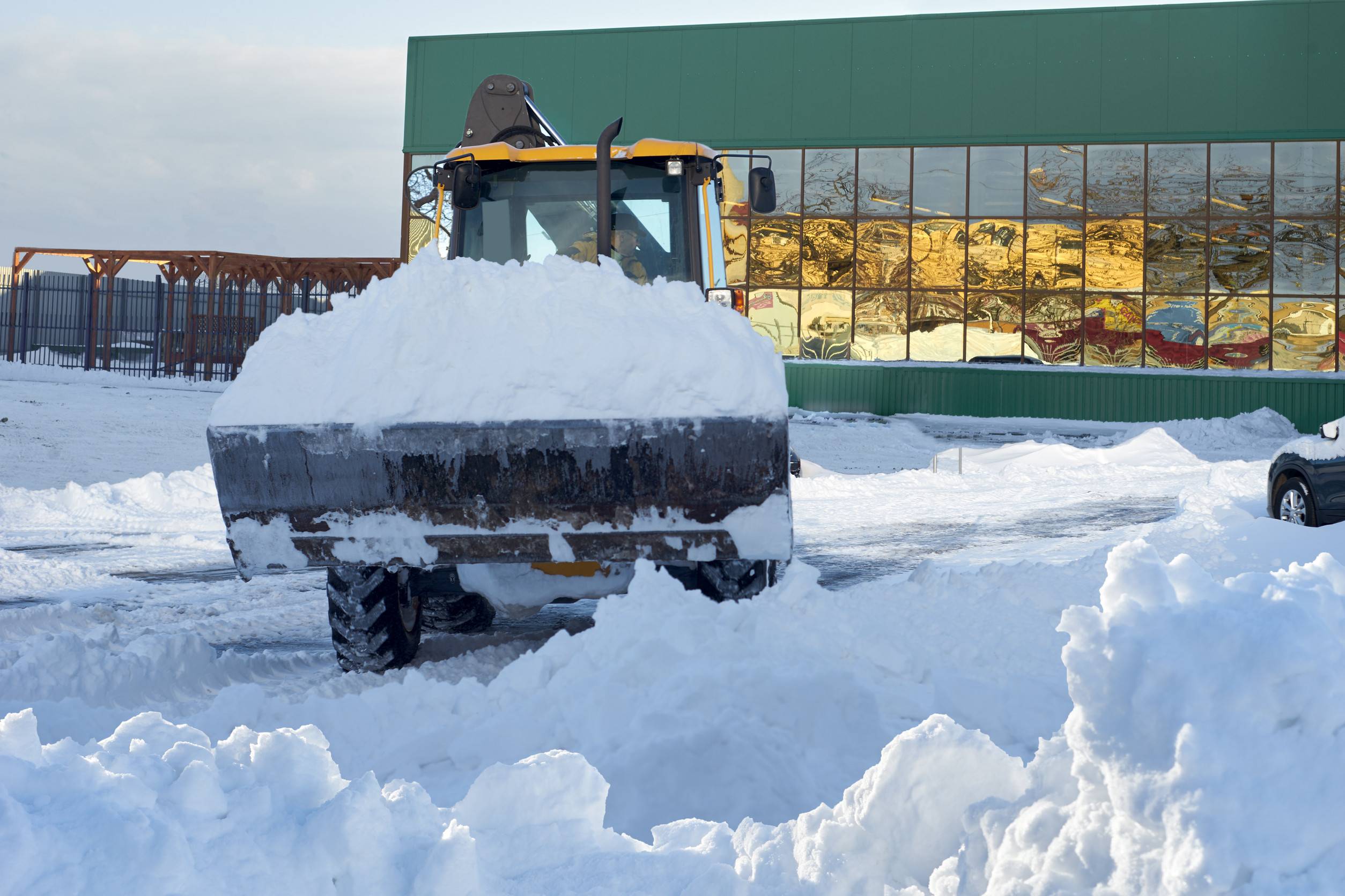 Commercial snow plow clearing snow